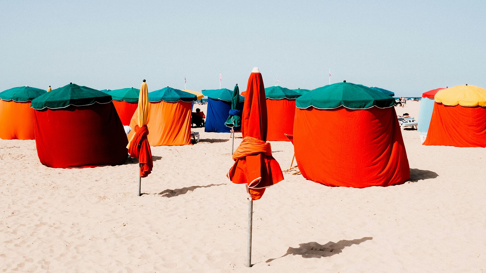 Coloured parasols on Deauville beach