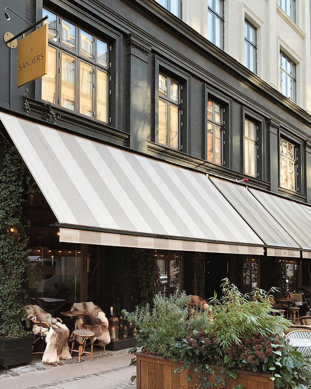 Striped awnings outside Hotel Sanders in Copenhagen.