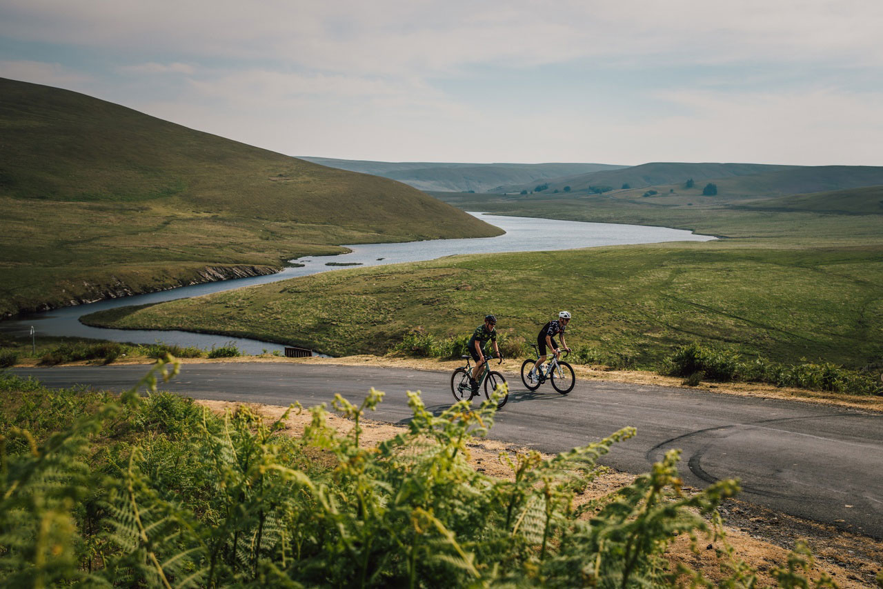 Two cyclists ride up out of Elan Valley.