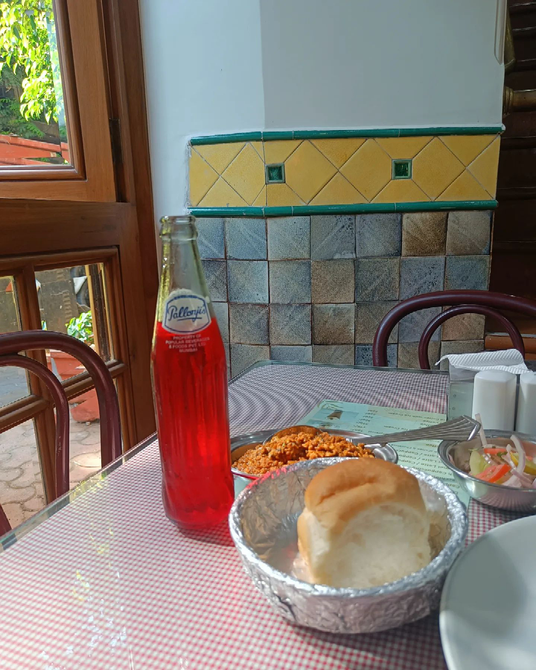 A pav and Pallonji’s raspberry soda served at Jimmy Boy restaurant in Fort, Mumbai.