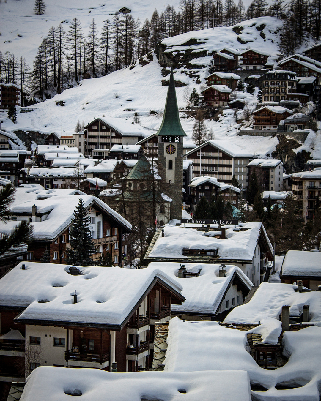 town in zermatt switzerland covered in snow photo by joel de vriend