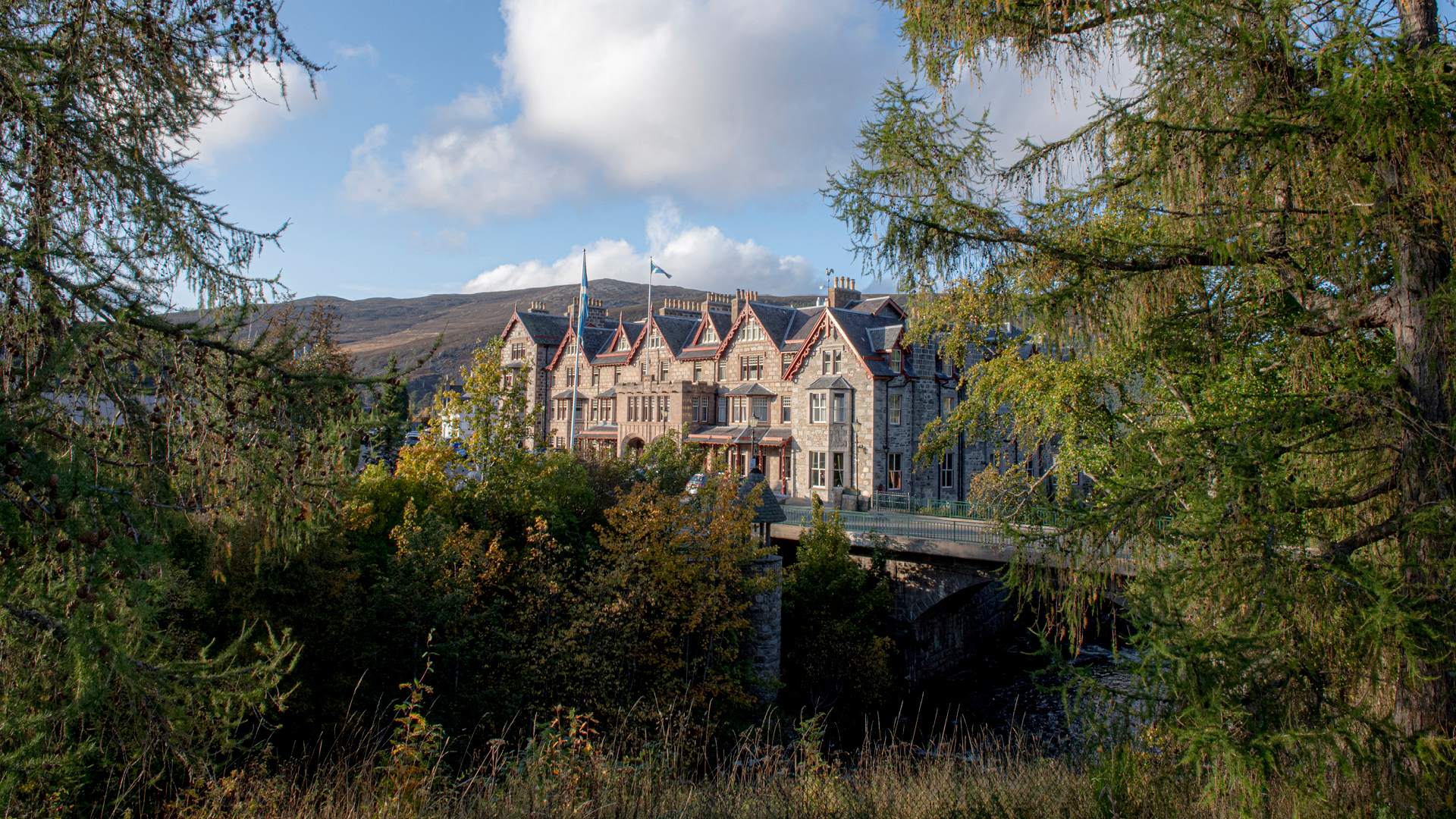 The Fife Arms set against the Cairngorms mountains