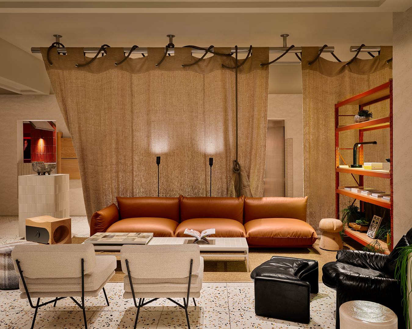 Linen curtains, leather sofas, terrazzo floors and design books decorate the lobby at The StandardX Melbourne