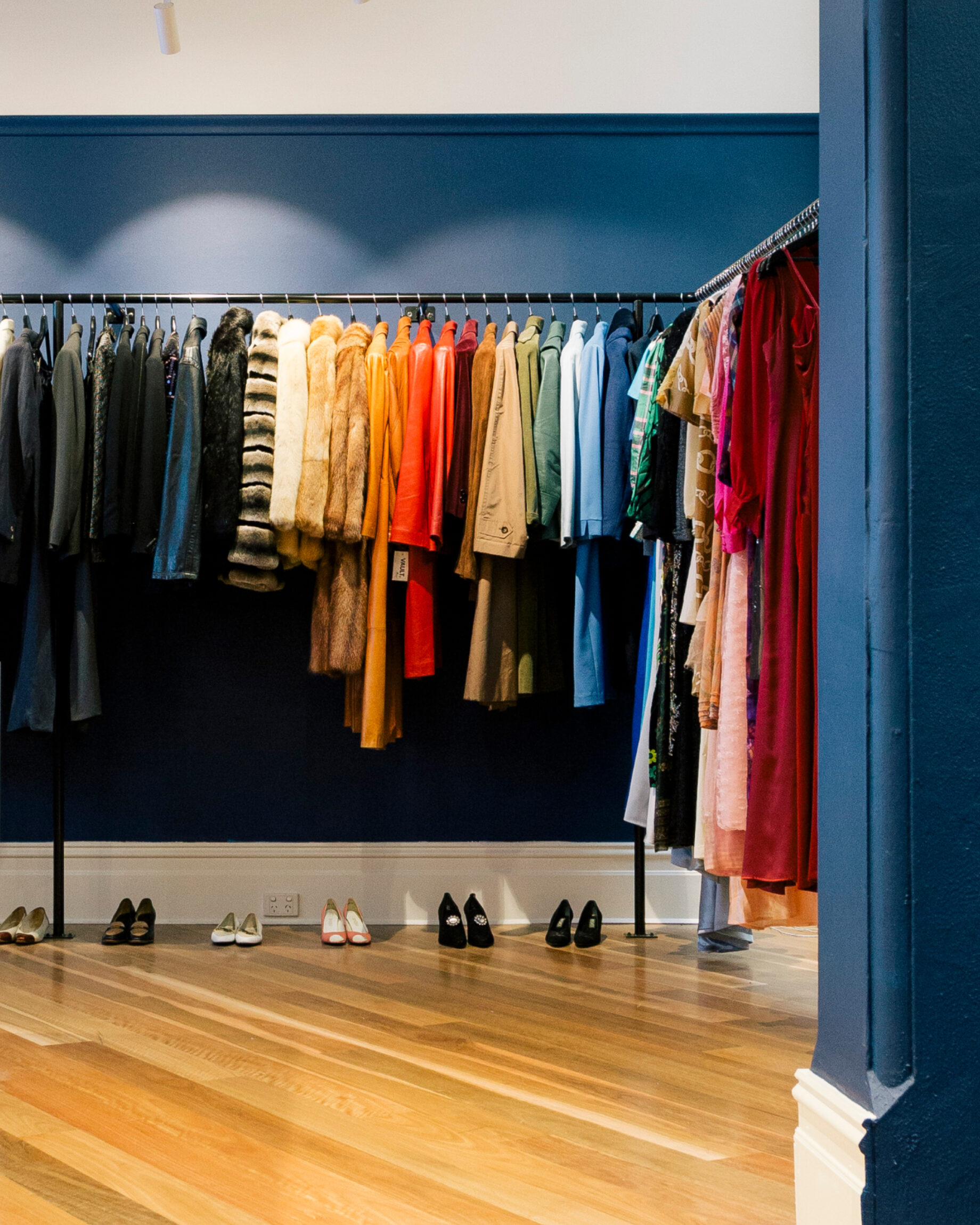 Colourful clothing on rails at vintage store Vault in Melbourne.