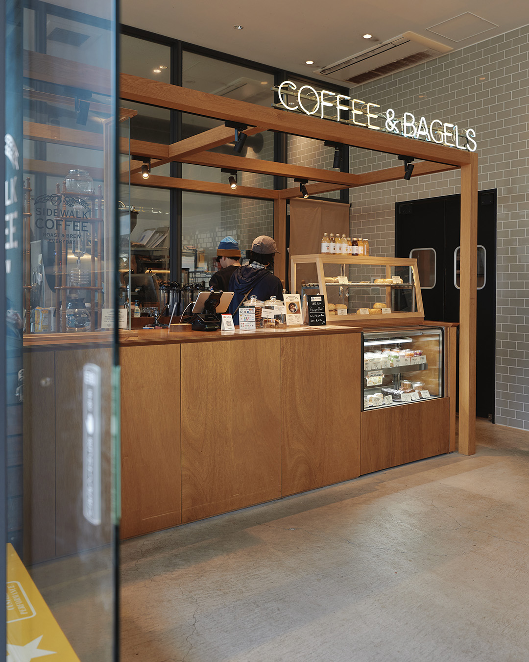 Sidewalk Coffee Roasters in Mustard Hotel, selling drinks and bagels