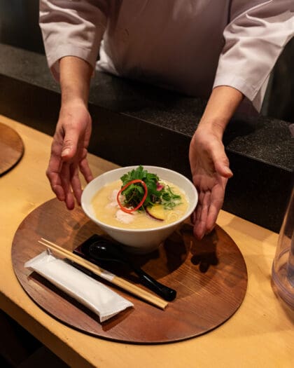 A bowl of ramen being served at Kangari, Ginza. Photography by Yuuki Tadokoro