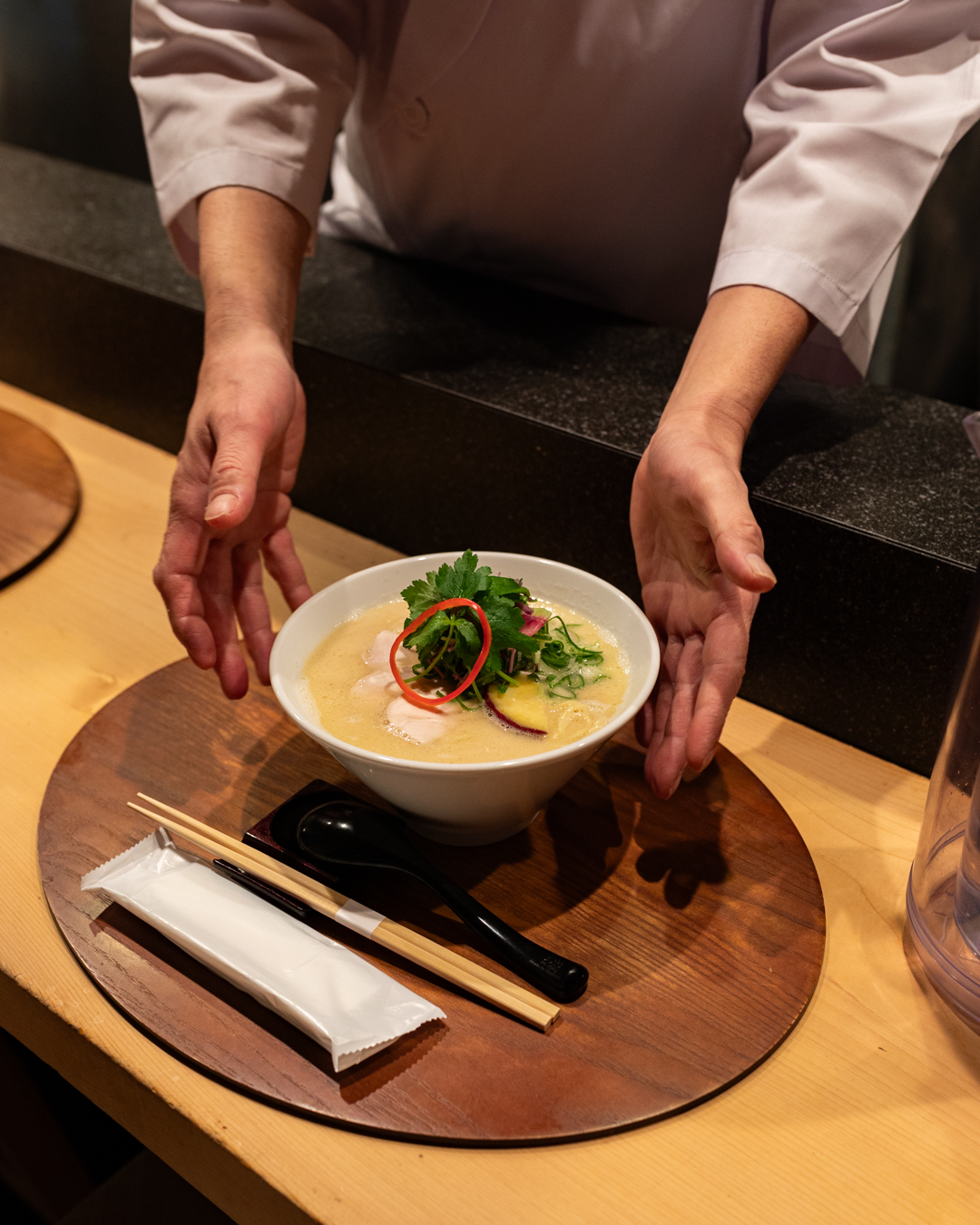 A bowl of ramen being served at Kangari, Ginza. Photography by Yuuki Tadokoro