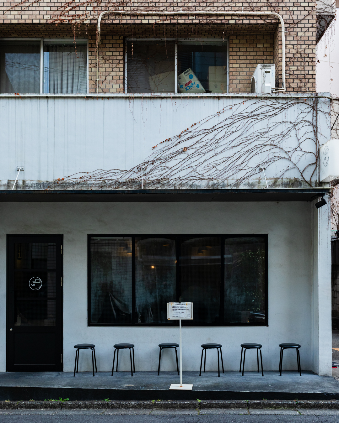 The pared-back exterior of Yakumo ramen restaurant in Tokyo. Photography by Yuuki Tadokoro